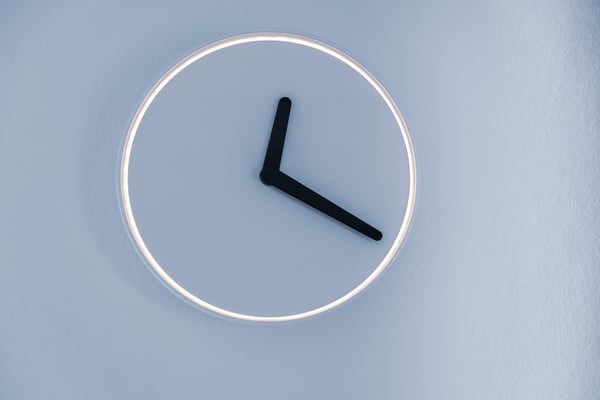 Analog clock on blue background