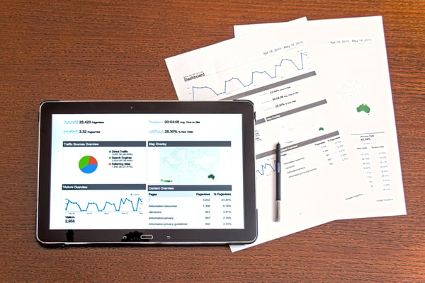 Analytical data on a tablet and paper