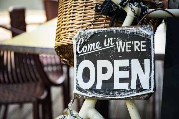 "Come in, we're open" sign