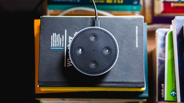 Echo Dot on top of stack of books