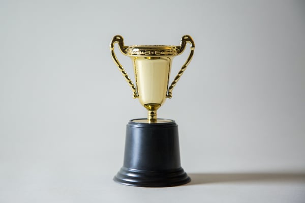 Golden trophy with black stand