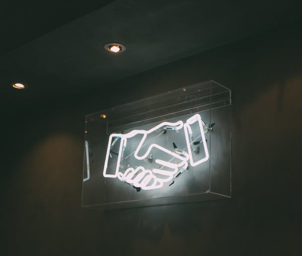 Handshake neon sign