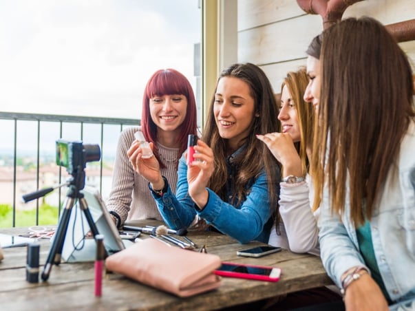 Influencer girl chatting in front of camera