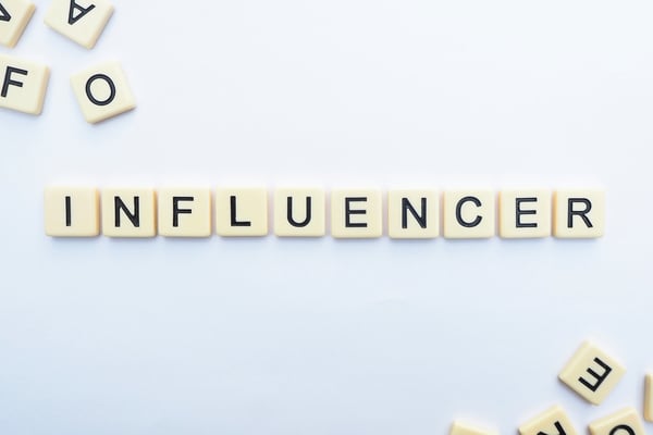 Influencer word written with game tiles