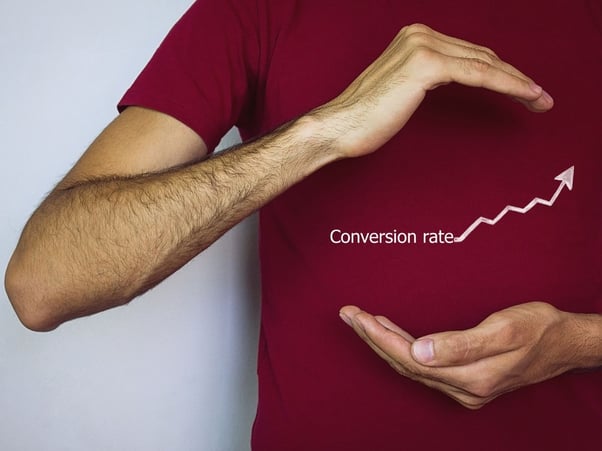 Man holding conversion rate graphic