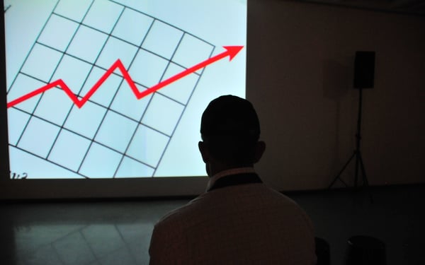 Man looking at graph