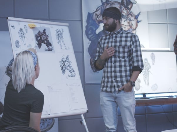 Man standing in front of a white presentation board