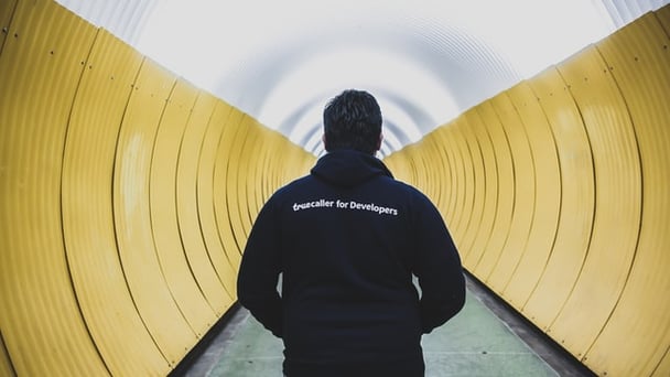 Man staying in yellow tunnel