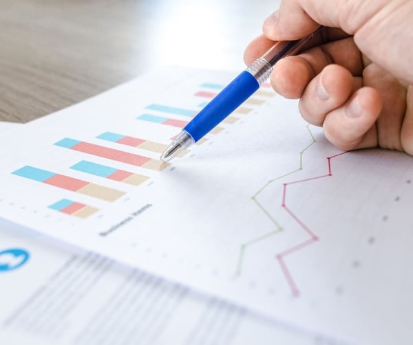 Man using pen to show data