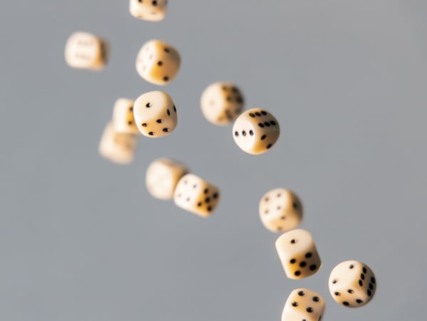 Multiple dice thrown up in air