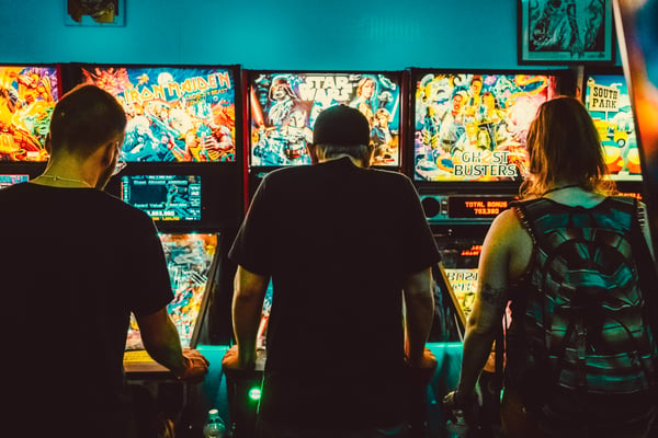 People playing arcade games