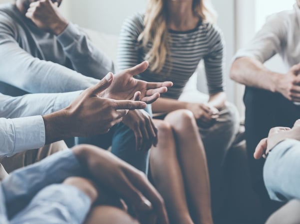 People sitting down and talking