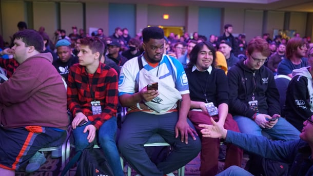 People sitting on chairs and laughing