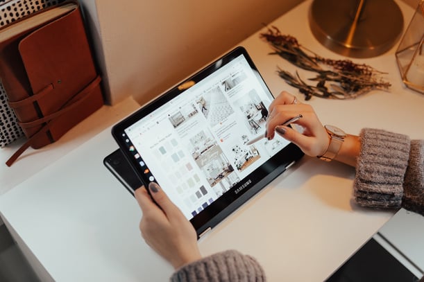 Person Holding black tablet