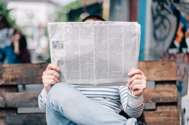 Person reading paper