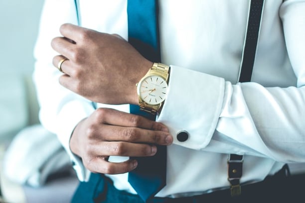 Person wearing blue tie 