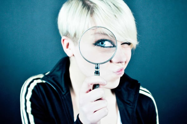 Person with magnifying glass