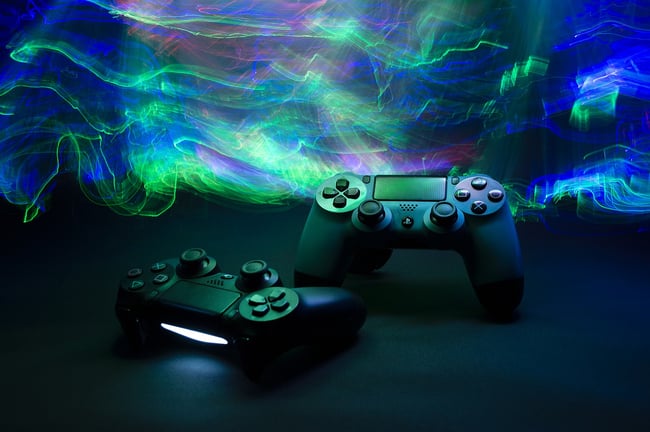PlayStation controllers on colored background