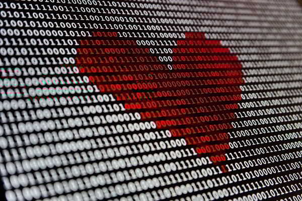 Red love heart in binary code