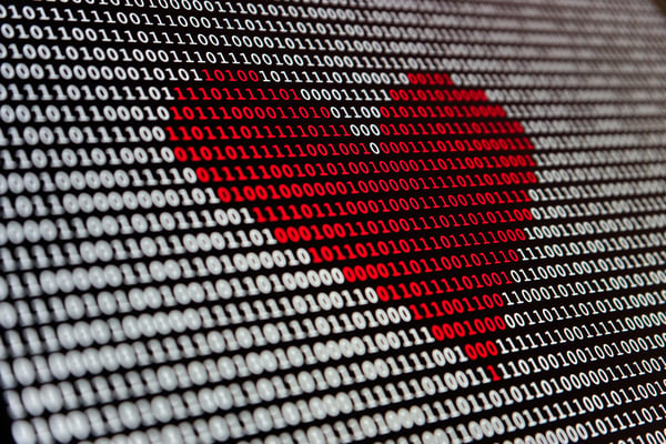 Red love heart in binary code