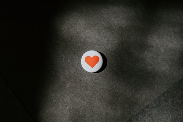 Red love heart on white button