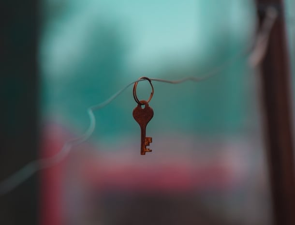 Rusted key on a chain