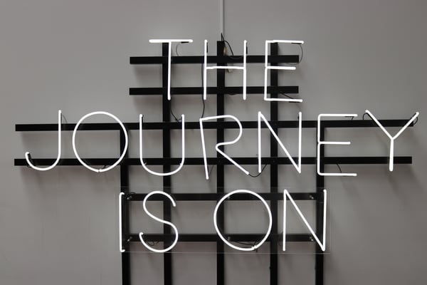 "The journey is on" neon sign