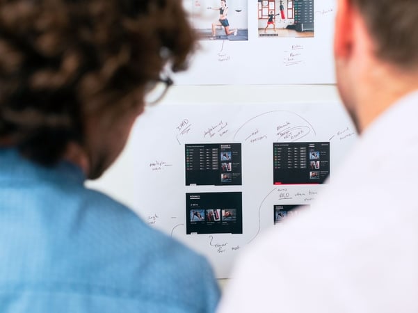 People looking at a board