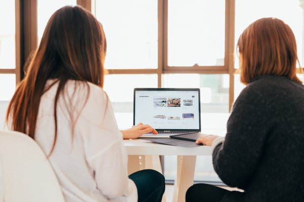 Two people working on same MacBook