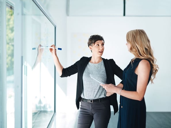 Two women discussing