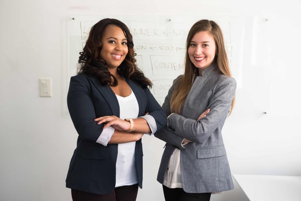 Two women standing next to each other