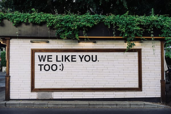 "We like you too" painted on wall