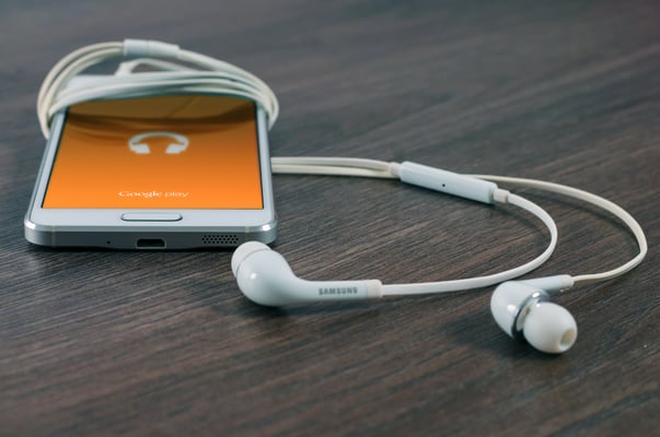 White phone with white headphones