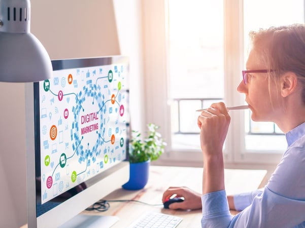 Woman looking at digital marketing screen