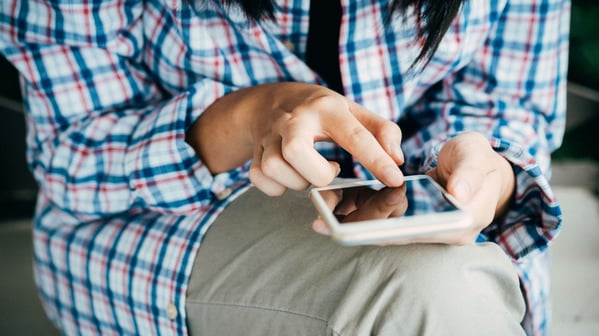 Woman playing on phone