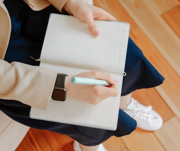 Woman taking notes