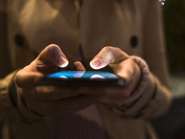 Woman typing on mobile