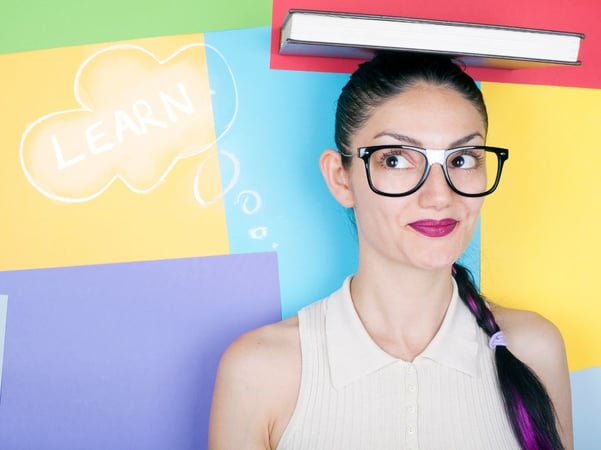 Woman with book on head