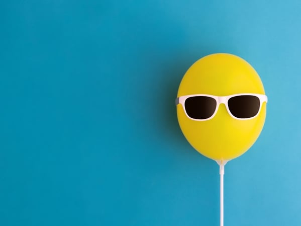 Yellow ballon with sunglasses