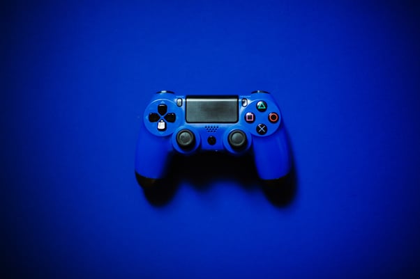 Blue controller on a blue background